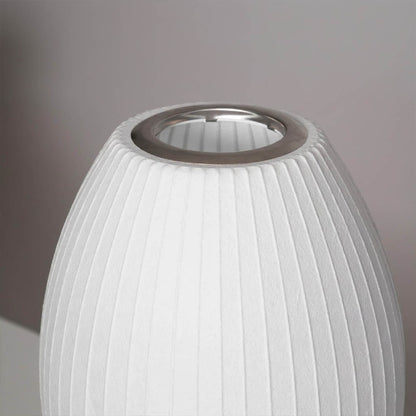 Astrid silk shade close up illuminated warm soft amber glow diffuse light Japandi Wabi Sabi quality material