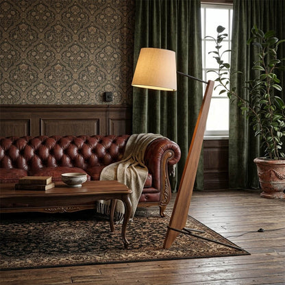 Atlas tall floor lamp beside sofa living room warm glow showing large scale modern interior