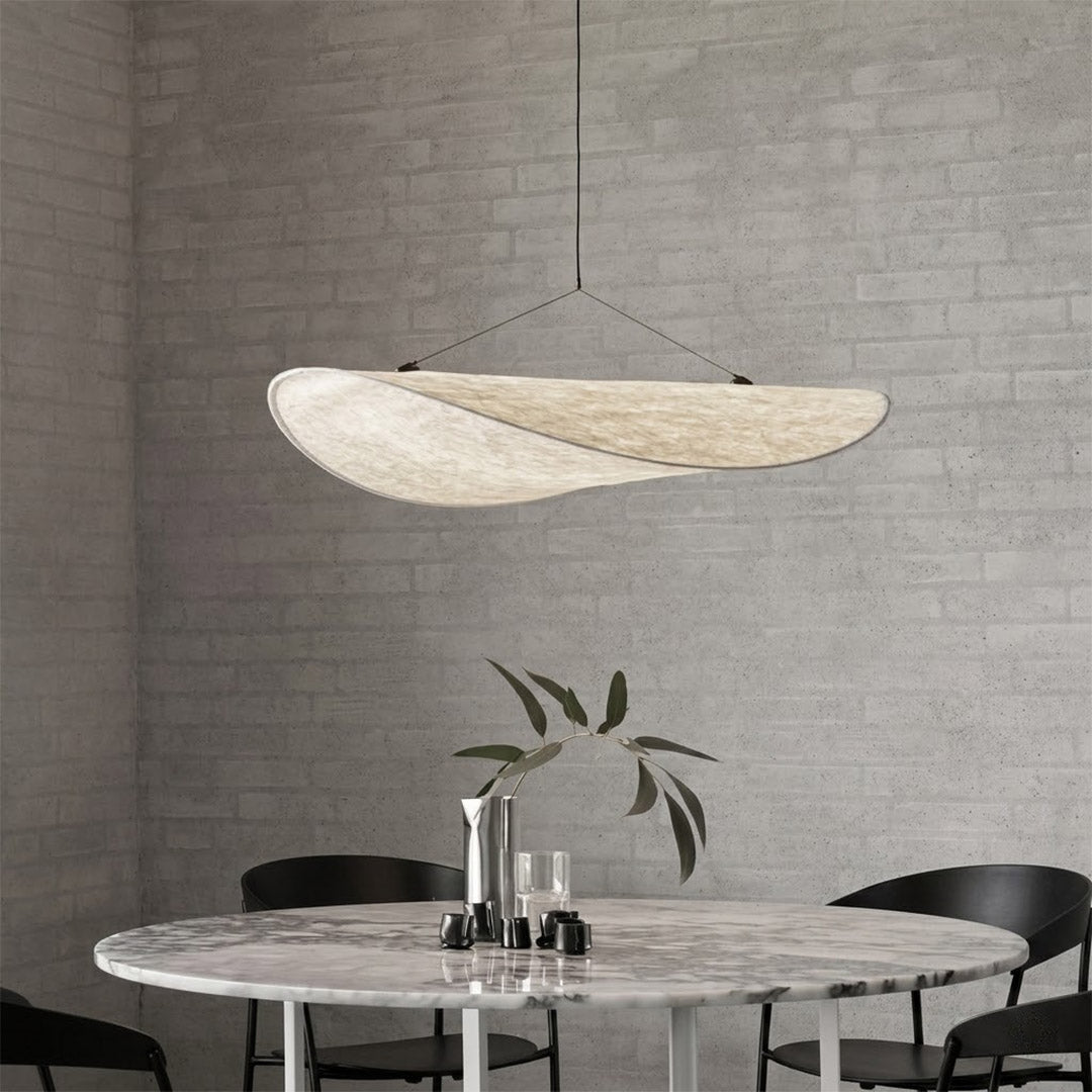 Aura 31 inch oversized disc pendant above modern dining table rectangular flat profile statement white halo