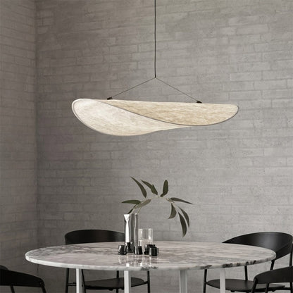 Aura 31 inch oversized disc pendant above modern dining table rectangular flat profile statement white halo