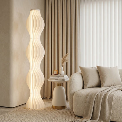 Aureli white wave LED floor lamp with sculptural acrylic shade by Stuberlighting