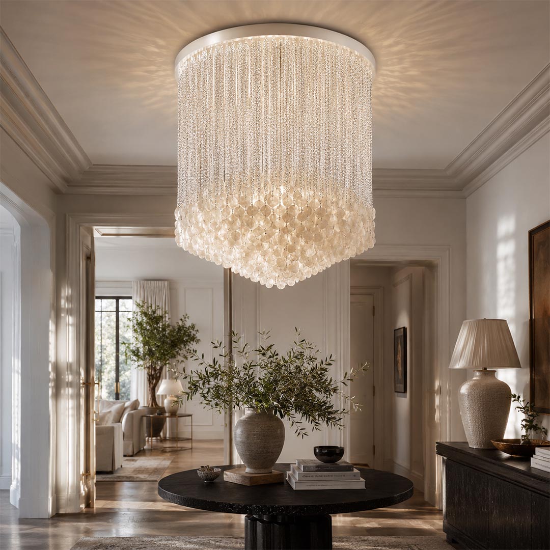 Statement-making glass cylinder flush mount ceiling light in a formal dining room, positioned over a dark table.