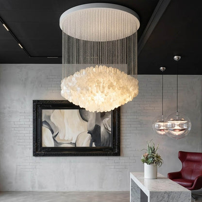 Aurelia FUN style grand cascade shell chandelier oceanfront modern mansion ocean view glass walls Coastal Mid Century designer mansion scale warm glow lifestyle interior