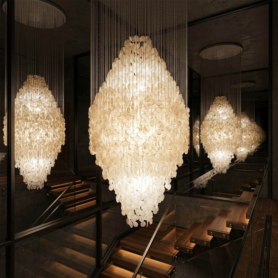 Aurelia 8DM FUN style grand cascade shell chandelier spiral staircase vertical cascade mansion oceanfront grand statement Mid Century designer warm glow lifestyle interior
