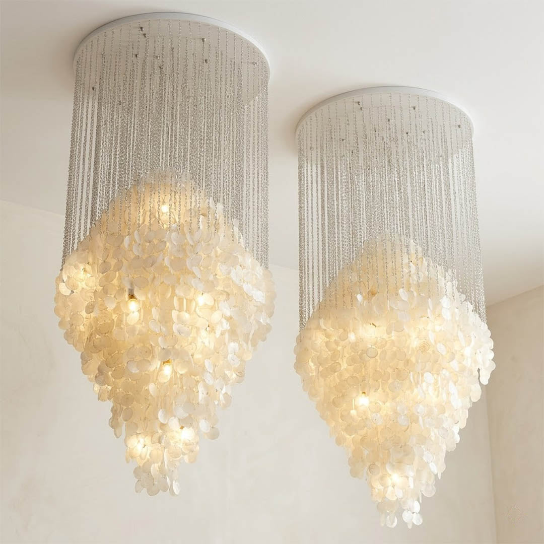 Aurelia 7DM FUN style grand cascade shell chandelier vaulted living room 16 ft ceiling grand mansion Coastal Mid Century designer warm glow lifestyle interior