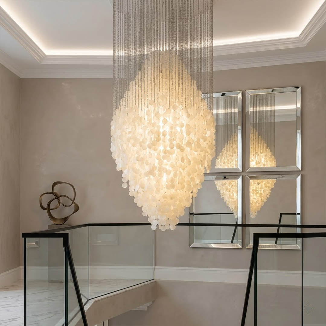 Aurelia 8DM FUN style grand cascade shell chandelier spiral staircase vertical cascade mansion oceanfront grand statement Mid Century designer warm glow lifestyle interior