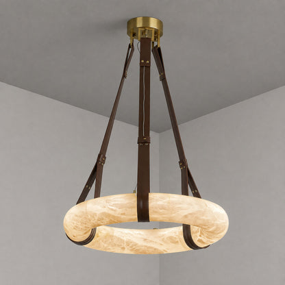 Model B Aureo alabaster pendant light with a dark brown strap in a refined dining space