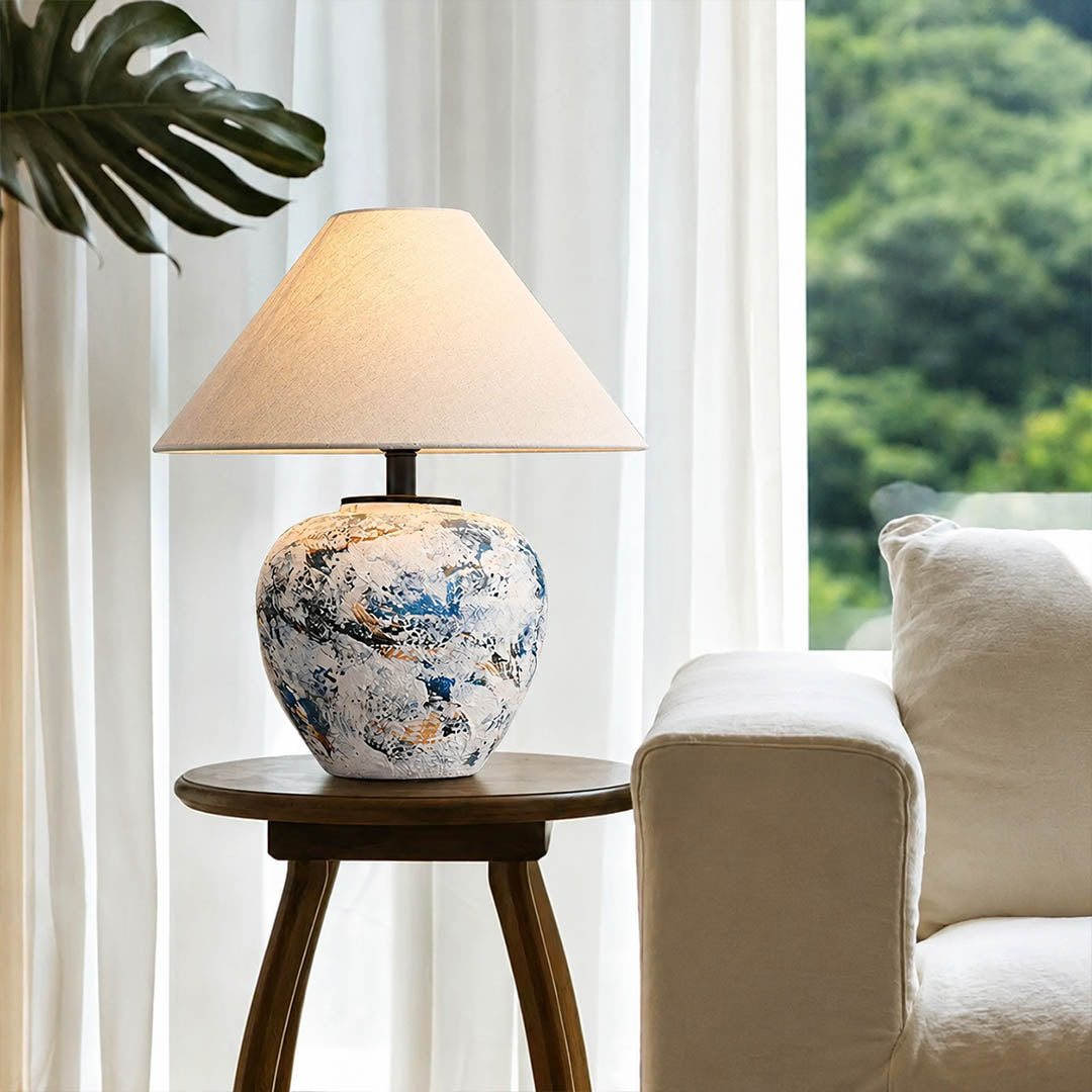 Azzurro ceramic table lamp living room side table beside white sofa blue white ceramic warm glow neoclassical American home lifestyle interior