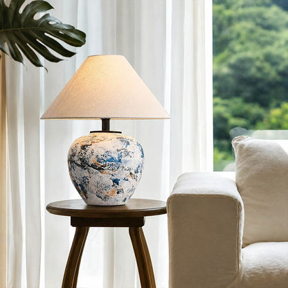 Azzurro ceramic table lamp living room side table beside white sofa blue white ceramic warm glow neoclassical American home lifestyle interior