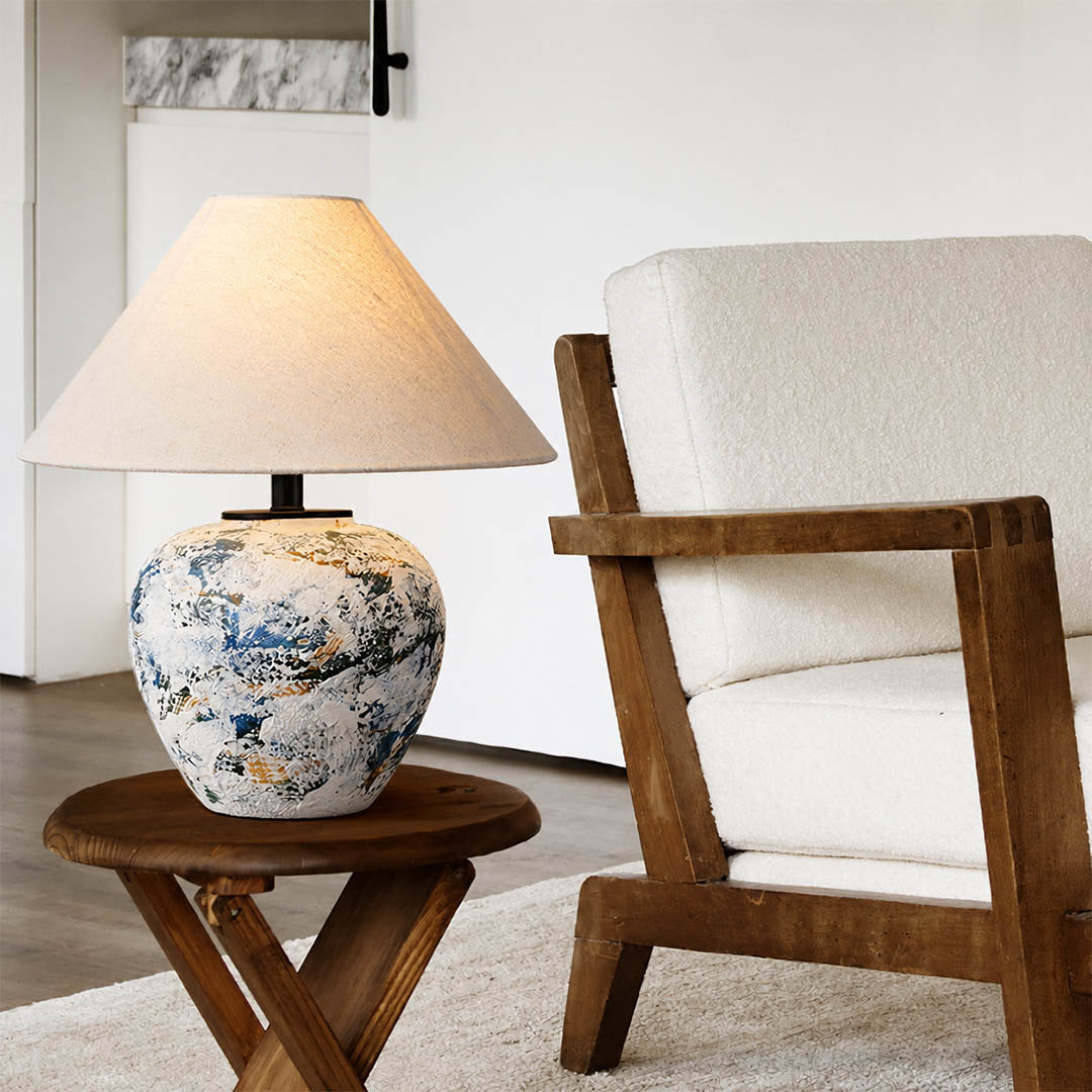 Azzurro ceramic table lamp living room side table beside white sofa blue white ceramic warm glow neoclassical American home lifestyle interior