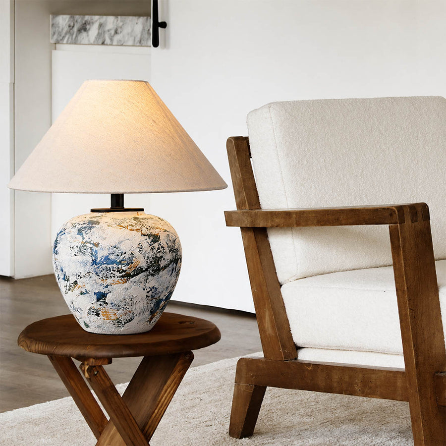Azzurro ceramic table lamp living room side table beside white sofa blue white ceramic warm glow neoclassical American home lifestyle interior