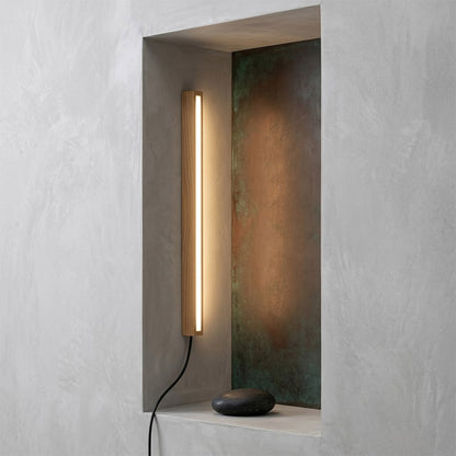 Beam wood linear LED wall light above bed headboard bedroom warm light japandi interior