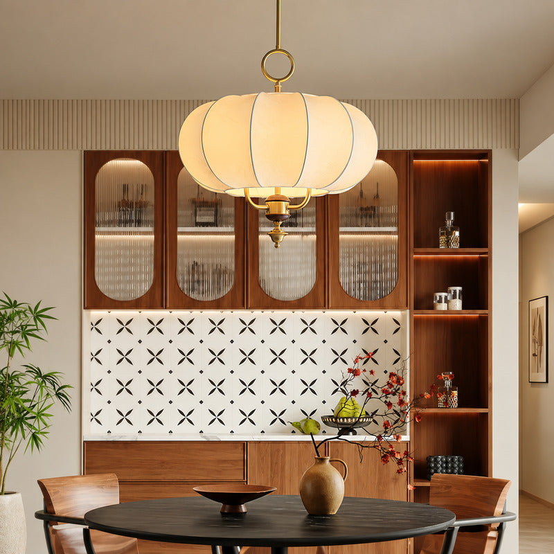 Belle floral lantern pendant casting a warm romantic glow over an elegant dining table