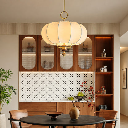 Belle floral lantern pendant casting a warm romantic glow over an elegant dining table