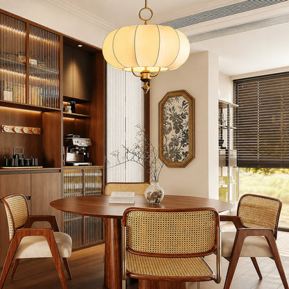 Belle floral lantern pendant casting a warm romantic glow over an elegant dining table