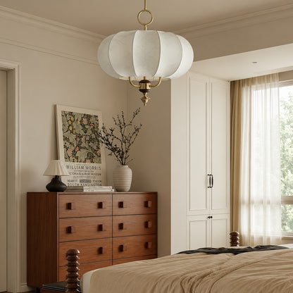 Belle lantern pendant adding a soft warm glow above a bedroom
