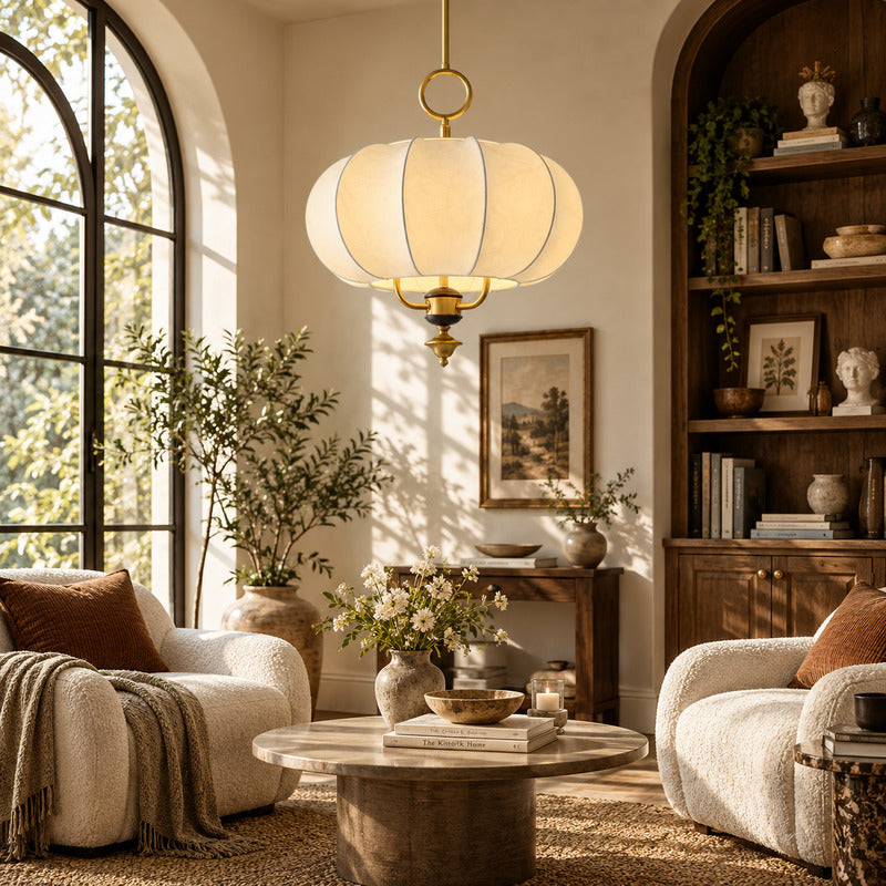 Belle lantern pendant casting a warm glow over a corner reading chair