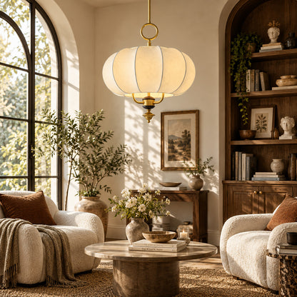 Belle lantern pendant casting a warm glow over a corner reading chair