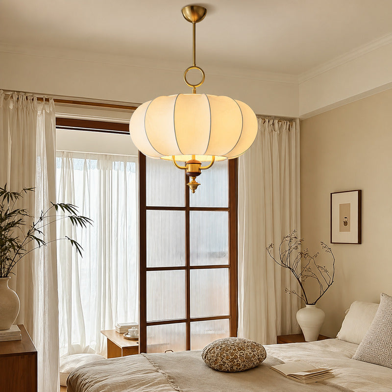 Belle lantern pendant adding a soft warm glow above a bedroom