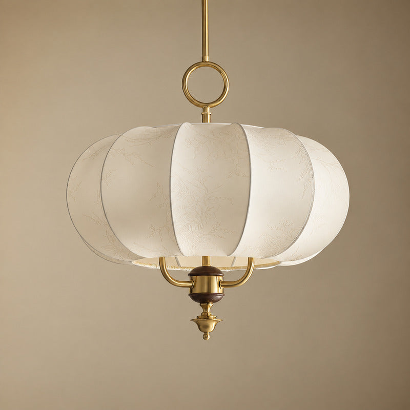 Gold and beige Belle floral fabric lantern pendant centered over a dining table