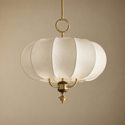 Gold and beige Belle floral fabric lantern pendant centered over a dining table