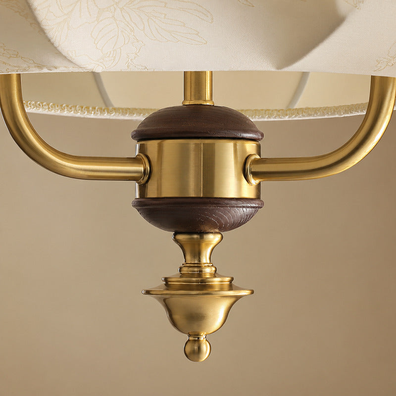 Detail of the walnut wood accent at the base of the Belle lantern pendant