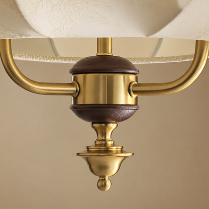 Detail of the walnut wood accent at the base of the Belle lantern pendant