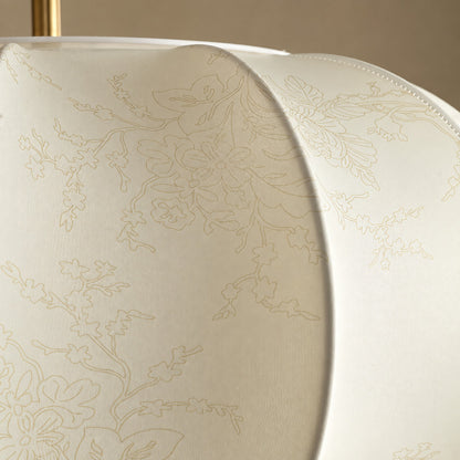 Close-up of the embossed floral pleated-fabric panels on the Belle lantern pendant
