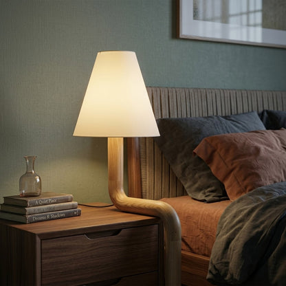 Modern bent wood table lamp with warm ambient LED lighting by Stuberlighting