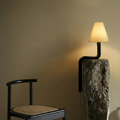 Modern bent wood table lamp with warm ambient LED lighting by Stuberlighting