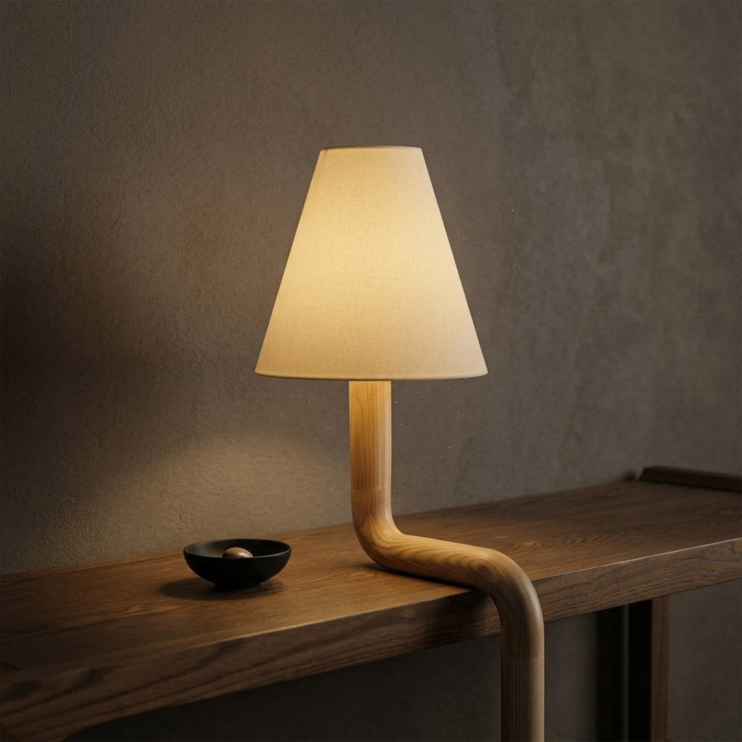 Modern bent wood table lamp with warm ambient LED lighting by Stuberlighting
