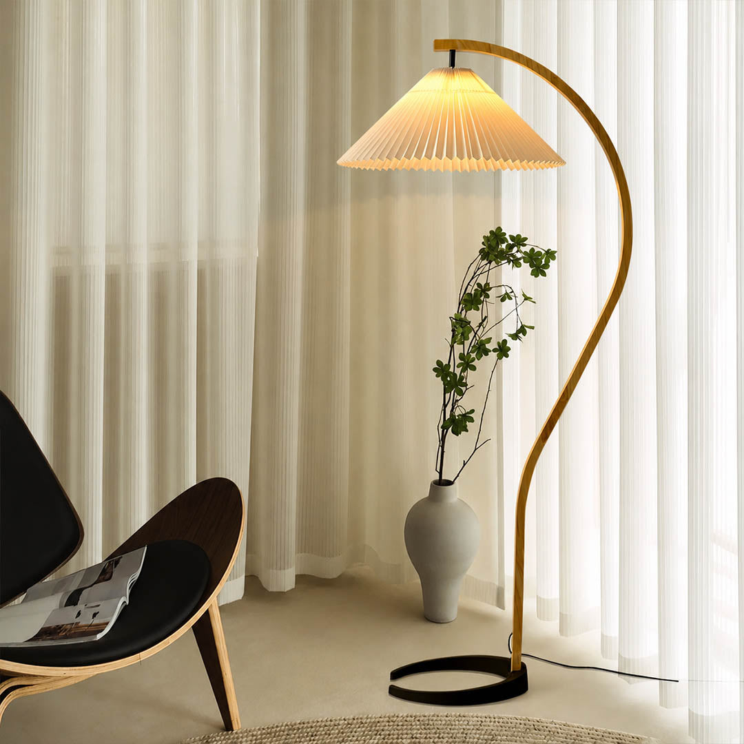 Bendik floor lamp beech wood beige linen shade reading corner armchair book cozy Scandinavian modern warm ambient sculptural Danish lifestyle interior