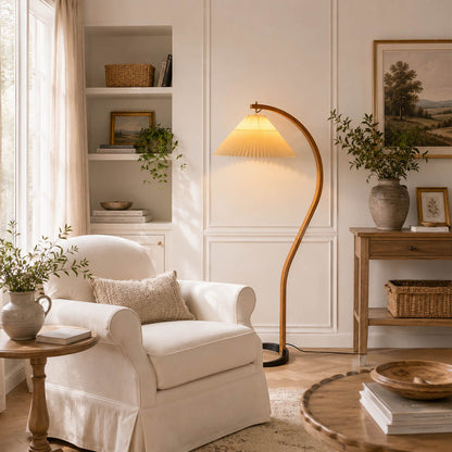 Bendik floor lamp beech wood beige linen shade reading corner armchair book cozy Scandinavian modern warm ambient sculptural Danish lifestyle interior