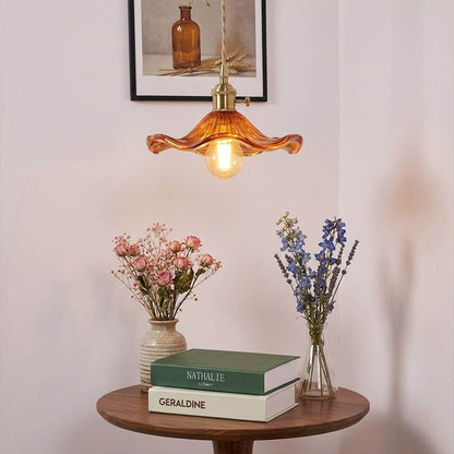 Bloom glass flower pendant lights cluster above kitchen island warm glow interior