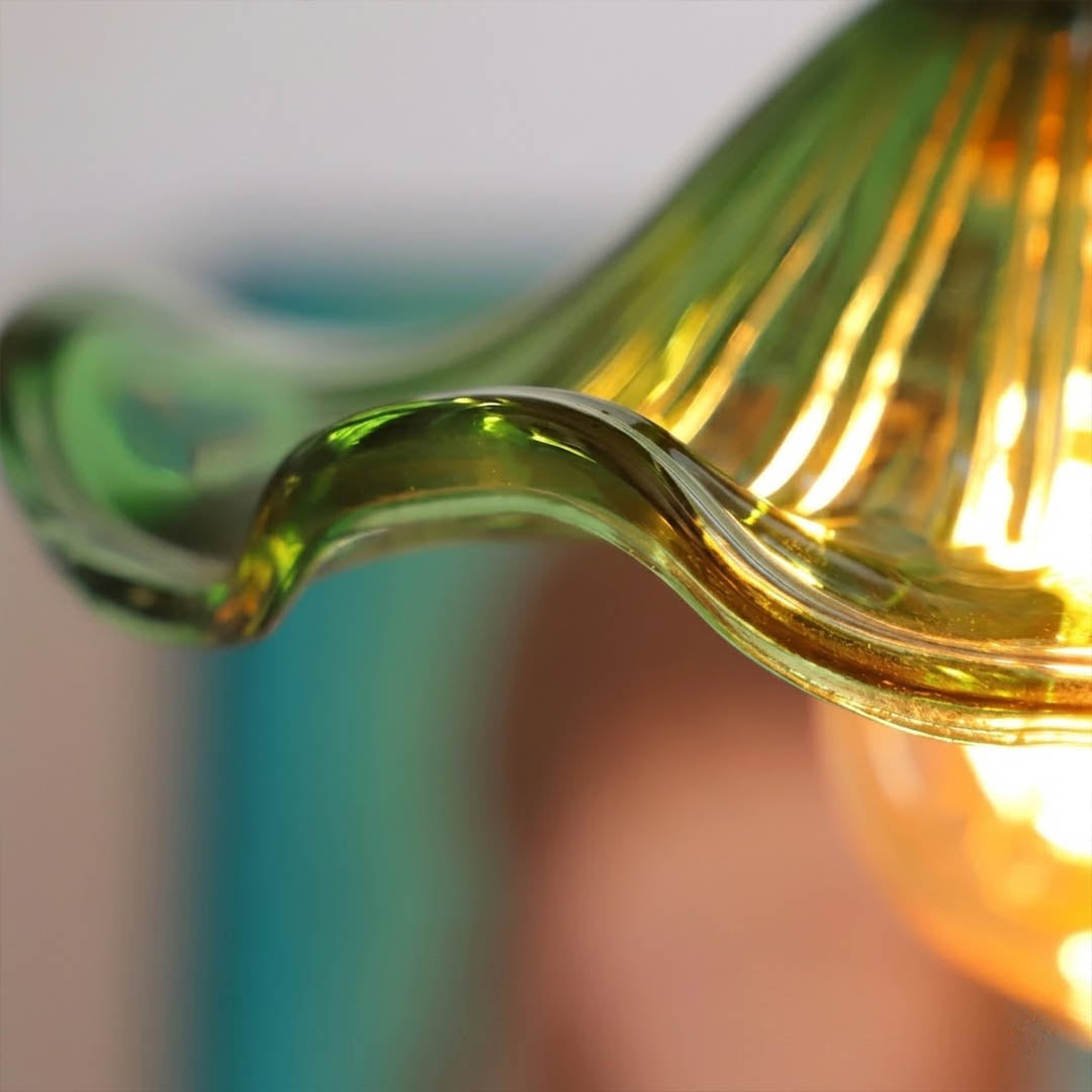 Bloom glass flower pendant light petal shaped shade brass detail close up