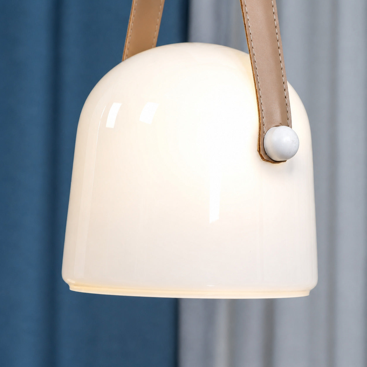 Bolla glass pendant light handblown glass shade tubular LED light shadow detail close up craftsmanship
