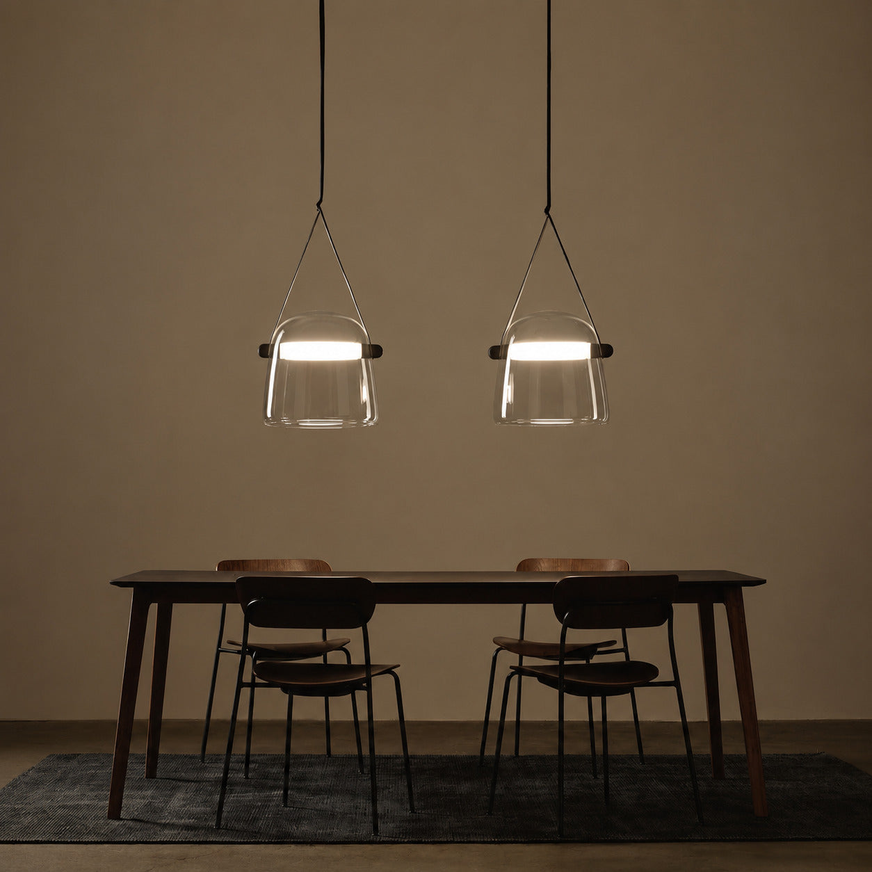 Bolla glass pendant light dining table bar top illuminated warm glow glass leather strap American home lifestyle interior styled