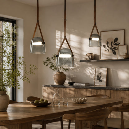 Bolla glass pendant light dining table bar top illuminated warm glow glass leather strap American home lifestyle interior styled