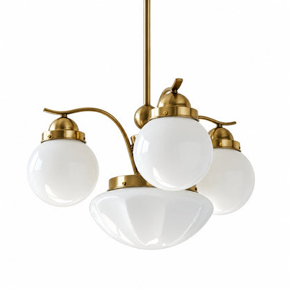 Four-light gold and white Bolla globe glass chandelier over a dining table