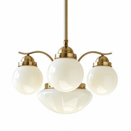 Four-light gold and beige Bolla globe glass chandelier in a warm mid-century dining room