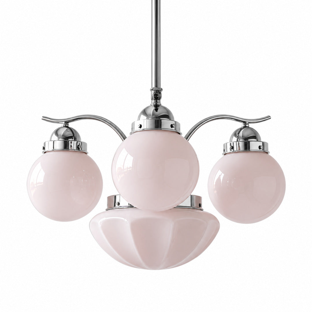 Four-light chrome and pink Bolla globe glass chandelier as a playful accent over a table