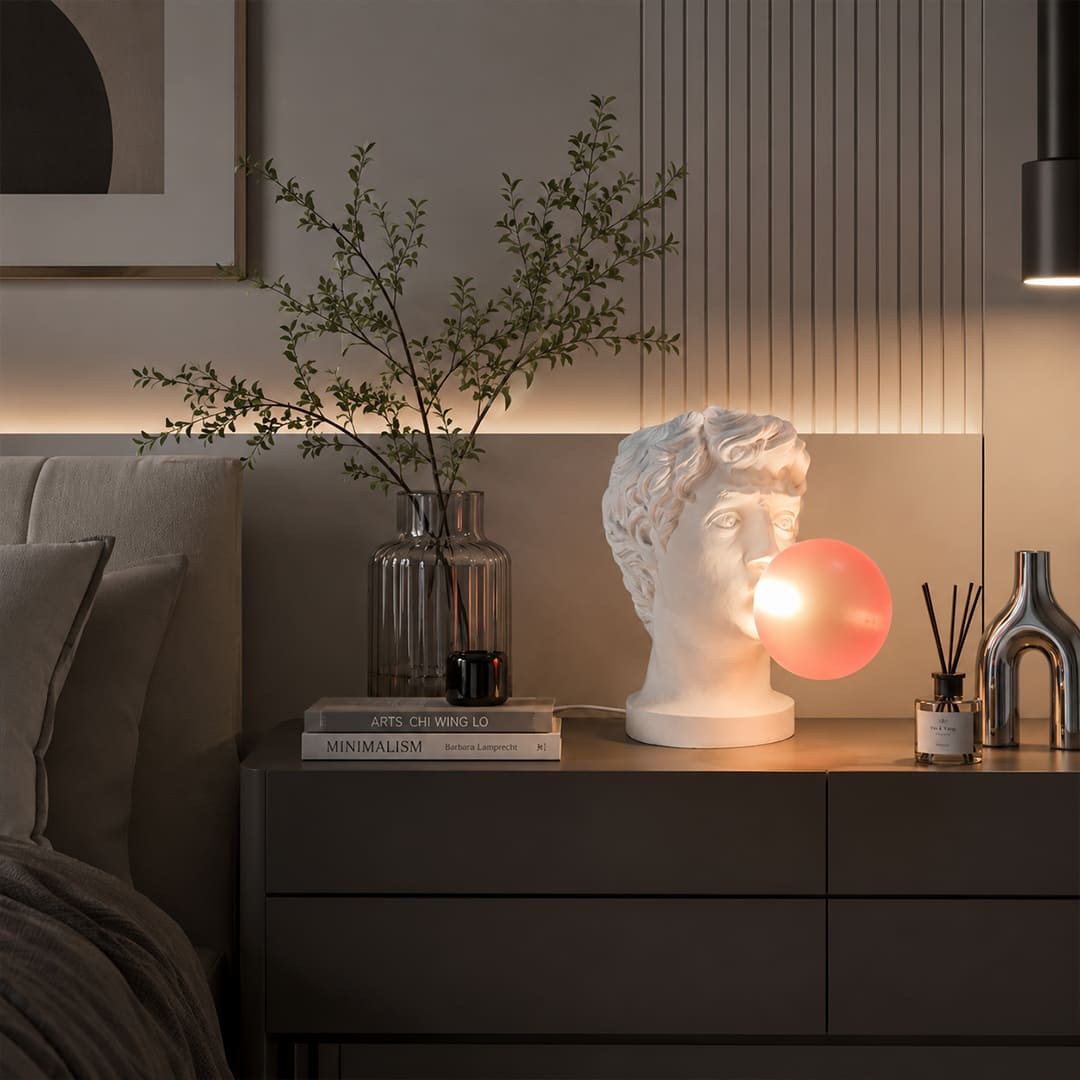 Bolla table lamp illuminated warm pink glow evening mood modern bedroom bedside primary intimate cozy playful whimsical romantic conversation starter lifestyle interior American home