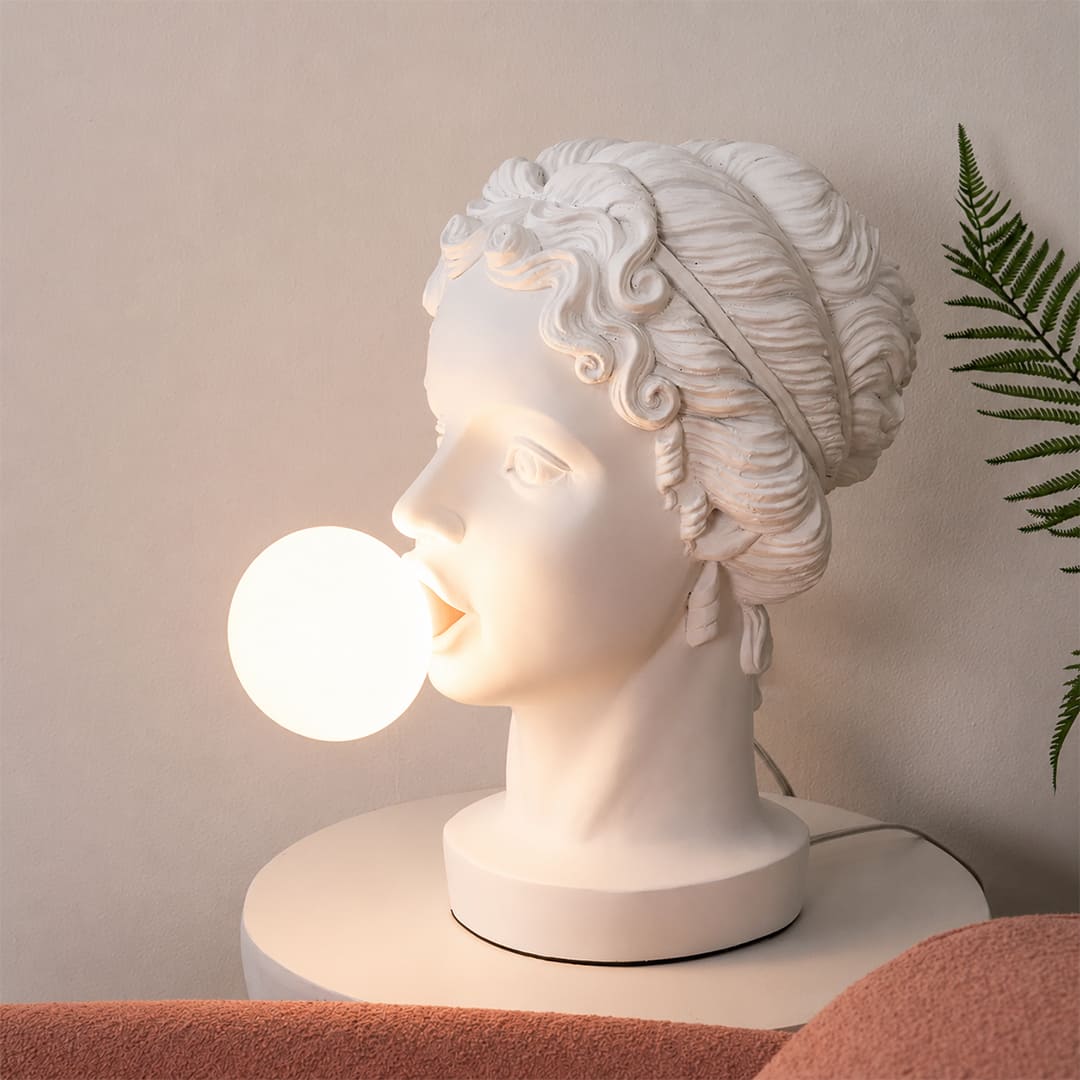 Bolla table lamp illuminated warm pink glow evening mood modern bedroom bedside primary intimate cozy playful whimsical romantic conversation starter lifestyle interior American home