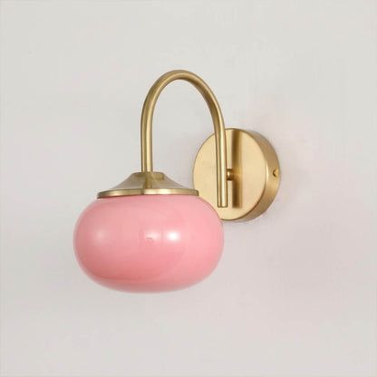 Bonbon wall sconce antique brass bow pink glass globe vintage white background