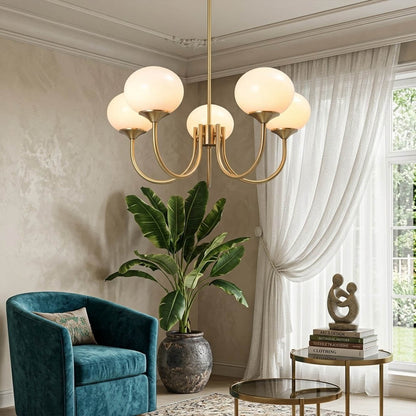 Bonbon glass globe chandelier above dining table warm glow modern interior