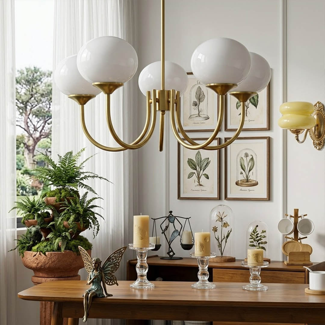 Bonbon glass globe chandelier above dining table warm glow modern interior