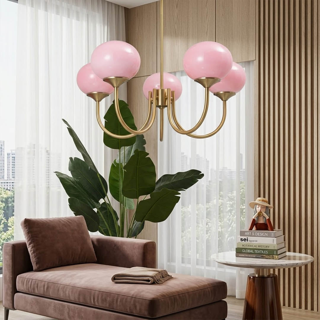 Bonbon glass globe chandelier above dining table warm glow modern interior
