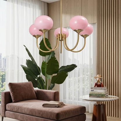 Bonbon glass globe chandelier above dining table warm glow modern interior