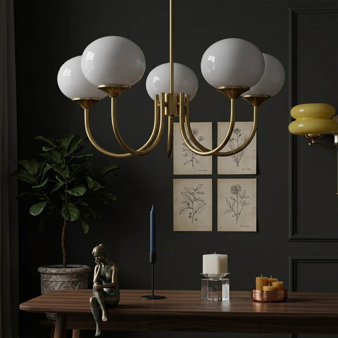 Bonbon glass globe chandelier above dining table warm glow modern interior