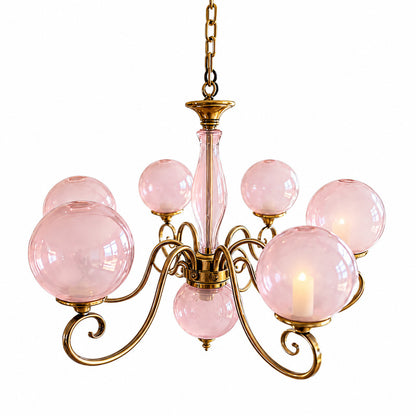 Boule glass chandelier with vintage French globe glass shades on a multi-arm frame glowing warm over a dining table